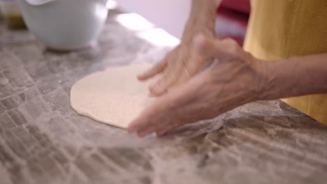 Woman-making-dough-for-tortilla