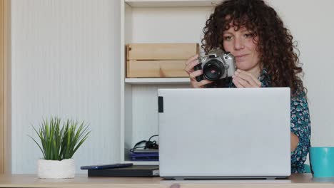 Smiling-photographer-working-in-home-office