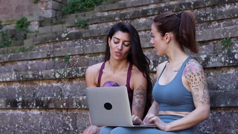 Content-diverse-women-having-yoga-lesson-via-laptop