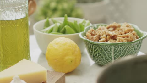 Fresh-raw-ingredients-for-pasta-preparation-arranged-on-table