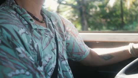 Hispanic-man-driving-van-in-summer