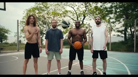 Portrait-of-a-multiracial-team-posing-and-standing-on-the-basketball-field.-Outdoor-sports-and-outdoor-activities