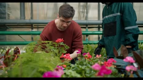 Botanical-Expert-Assists-Young-Man-in-Choosing-Perfect-Plants