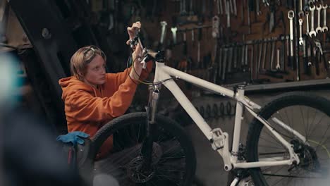Precision-and-Focus:-Teenager's-Bike-Repair-Expertise-in-the-Workshop