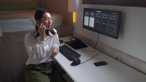 Ethnic-woman-having-phone-during-remote-work-with-cryptocurrency