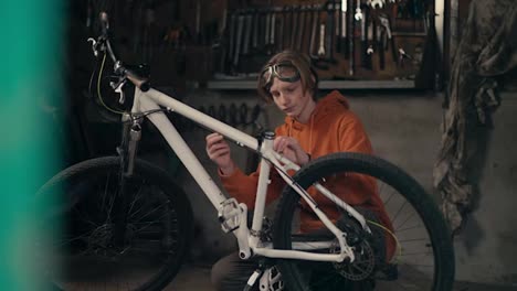 Serious-Dedication:-Teenager's-Passion-for-Bike-Maintenance-and-Repair-in-the-Workshop