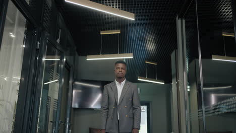 portrait-of-confident-black-businessman-or-manager-in-modern-office-look-at-camera-business-suit