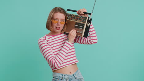 Woman-using-retro-tape-record-player-to-listen-music-disco-dancing-of-favorite-track-having-fun