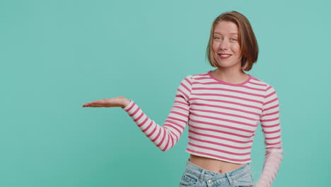 Young-woman-showing-thumbs-up-and-pointing-at-left-on-blank-space,-place-for-your-advertisement-logo