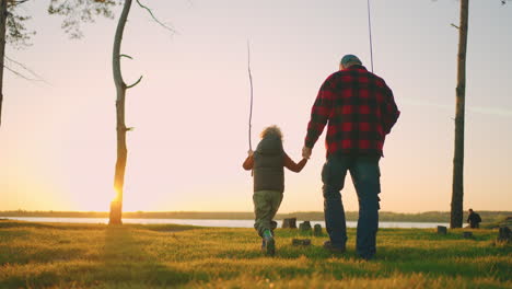 little-boy-is-spending-time-with-grandfather-in-nature-old-fisher-and-child-are-going-to-river-shore-for-fishing