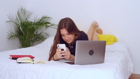 Teenager-with-gadgets-studying-online-at-home