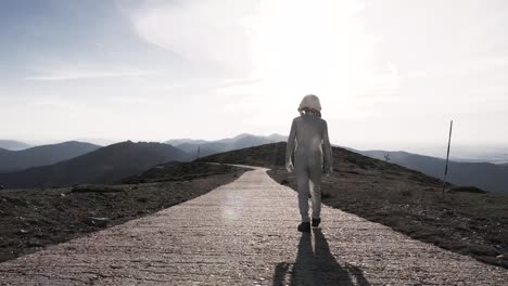Spaceman-walking-on-path-in-countryside