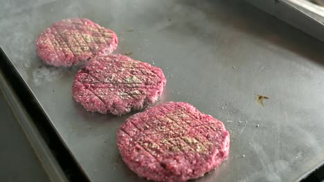 Grilling-hamburger-cutlets-cooking-in-kitchen