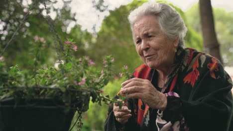 Senior-female-with-flowers-in-garden