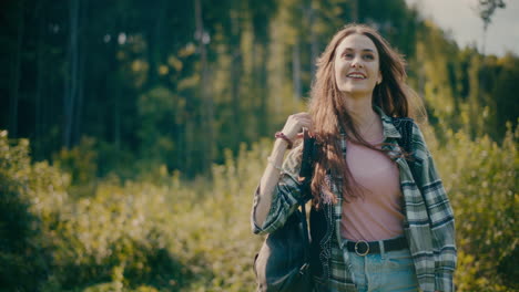 Smiling-Woman-Enjoying-Walking-In-Forest