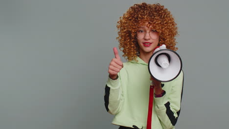 Teenager-girl-scream-shout-in-megaphone-loudspeaker-announces-discount-sale-announcing-advertisement