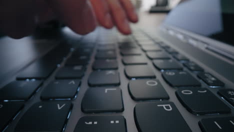 Macro-Shot:-Businessman-hand-work-on-capable-laptop-computer-at-office-table-close-up-shot-and-selective-focus-at-middle-section-of-laptop-computer-keyboard-while-typing-and-working