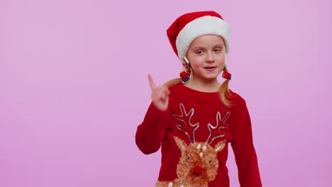 Girl-in-Christmas-sweater-listening-music-via-earphones,-dancing-disco-fooling-around-having-fun