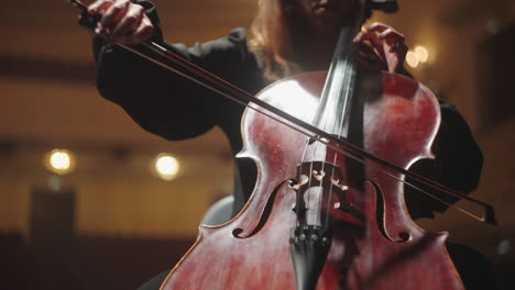 concert-of-classic-music-in-philharmonic-hall-woman-is-playing-cello-in-music-hall-beautiful-female-cellist