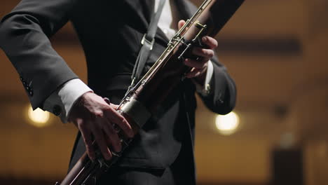 talented-bassoonist-is-playing-music-during-concert-in-opera-house-musician-with-bassoon-on-scene