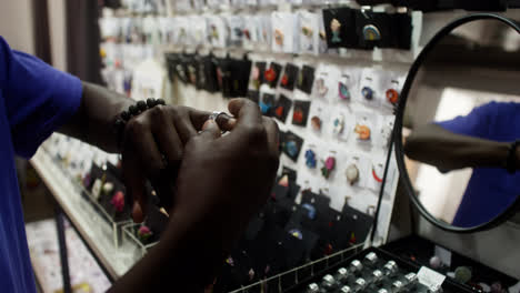 Close-up-view-of-young-man-hands-in-a-store