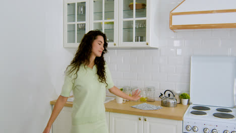 Woman-dancing-in-the-kitchen