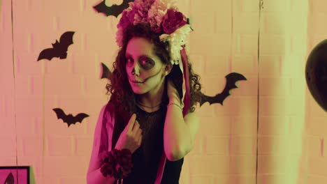 Woman-looking-at-camera-at-a-Halloween-party