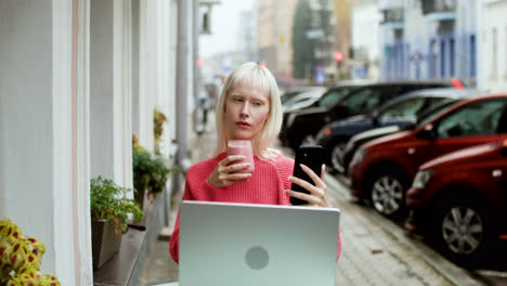 Blond-woman-videocalling-at-the-terrace