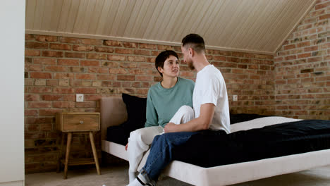Couple-talking-on-the-bed