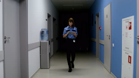 Woman-in-uniform-walking-on-the-hallway