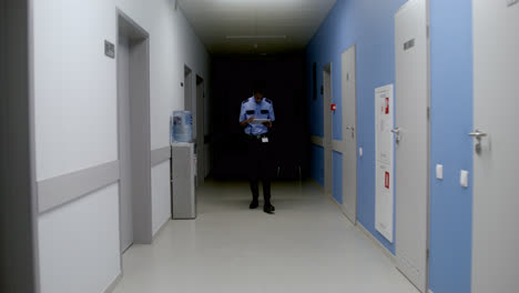 Man-in-uniform-working-on-the-corridor
