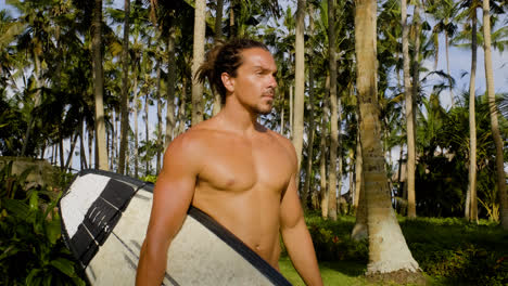 Man-holding-surfboard