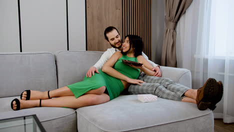 Couple-enjoying-time-on-the-sofa