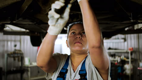 Woman-repairing-car