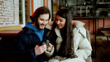 Young-man-and-woman-drinking-coffee