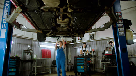 Woman-repairing-car