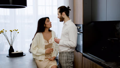 Young-couple-kissing-on-the-kitchen