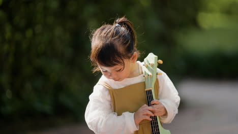 Child-with-musical-instrument-outdoors