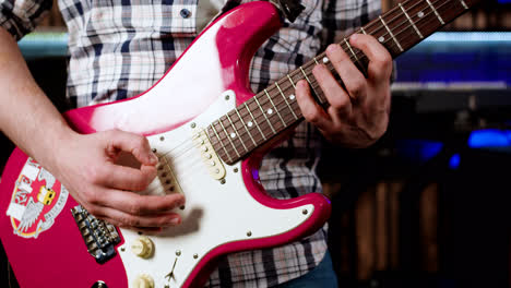 Hands-man-playing-guitar