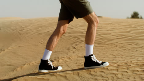 Male-adventurer-crossing-the-desert