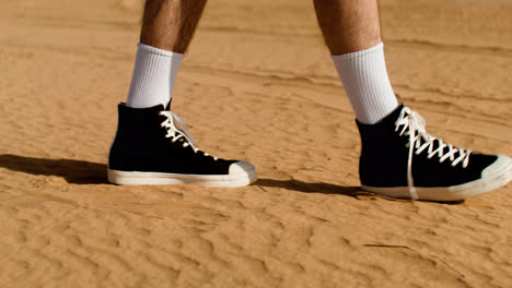 Man-with-black-sneakers-walking