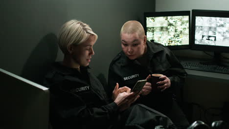Safety-guards-talking-and-using-a-smartphone-in-a-room