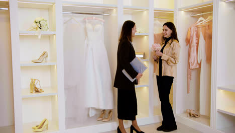 Asian-and-caucasian-woman-in-wedding-dress-shop