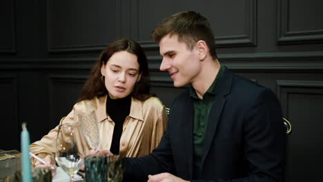 Couple-sitting-at-elegant-table