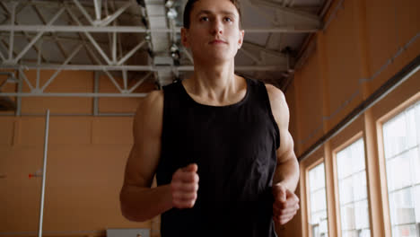 Young-man-running-indoors