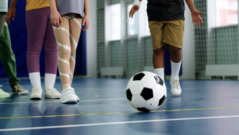 Kid-kicking-soccer-ball
