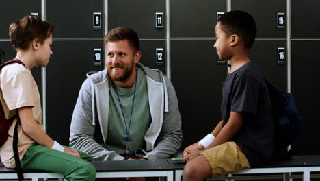 Man-and-children-at-the-locker-room