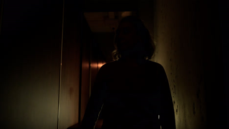 Woman-in-the-hallway-at-night