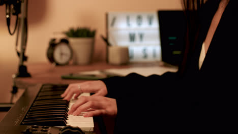 Side-view-of-woman-playing-keyboard
