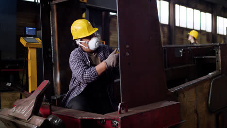 Worker-sanding-down-the-structure